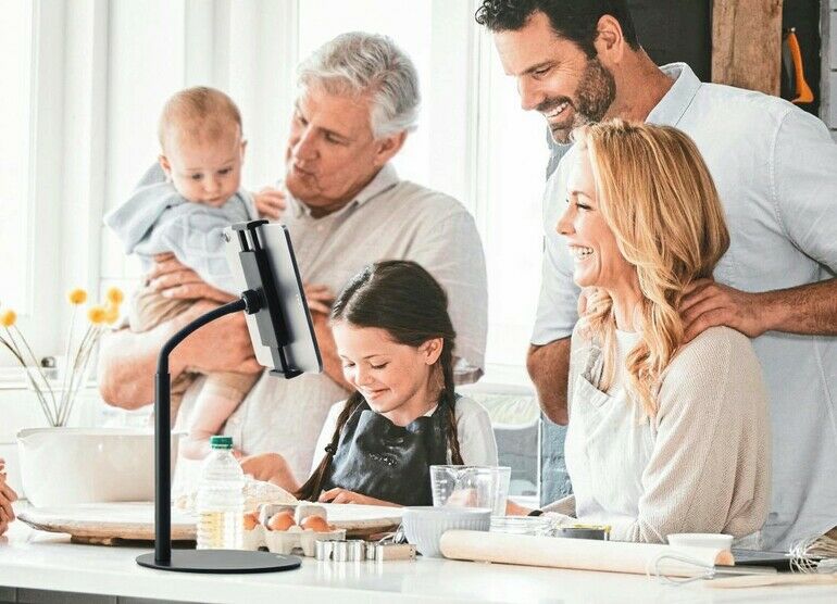 Happy_big_family,_kitchen_and_cooking_in_home,_bonding_and_having_fun._Love,_care_and_grandparents,_mother_and_father,_baby_and_girl_learning_baking_and_enjoying_quality_time_together_in_family_home.
